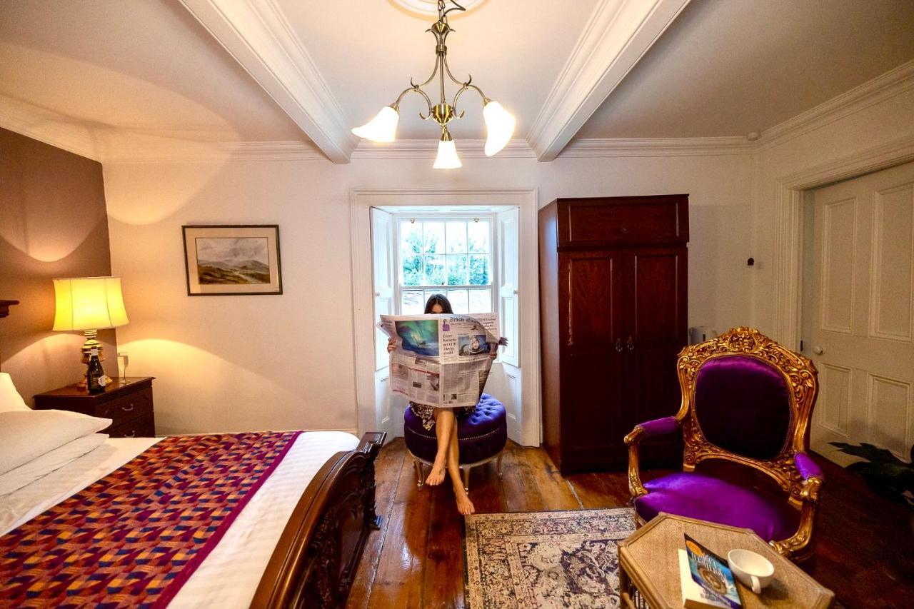 Clone Country House Aughrim Esterno foto A guest reading the Irish Times in the hotel