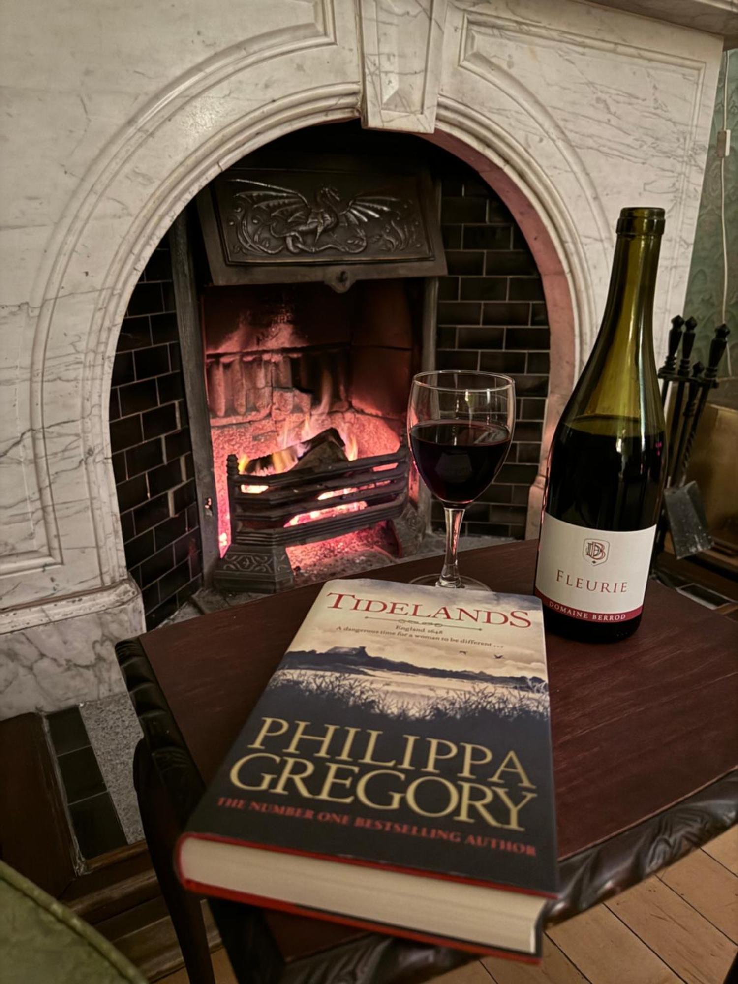 Clone Country House Aughrim Esterno foto A wine and book at the fireplace